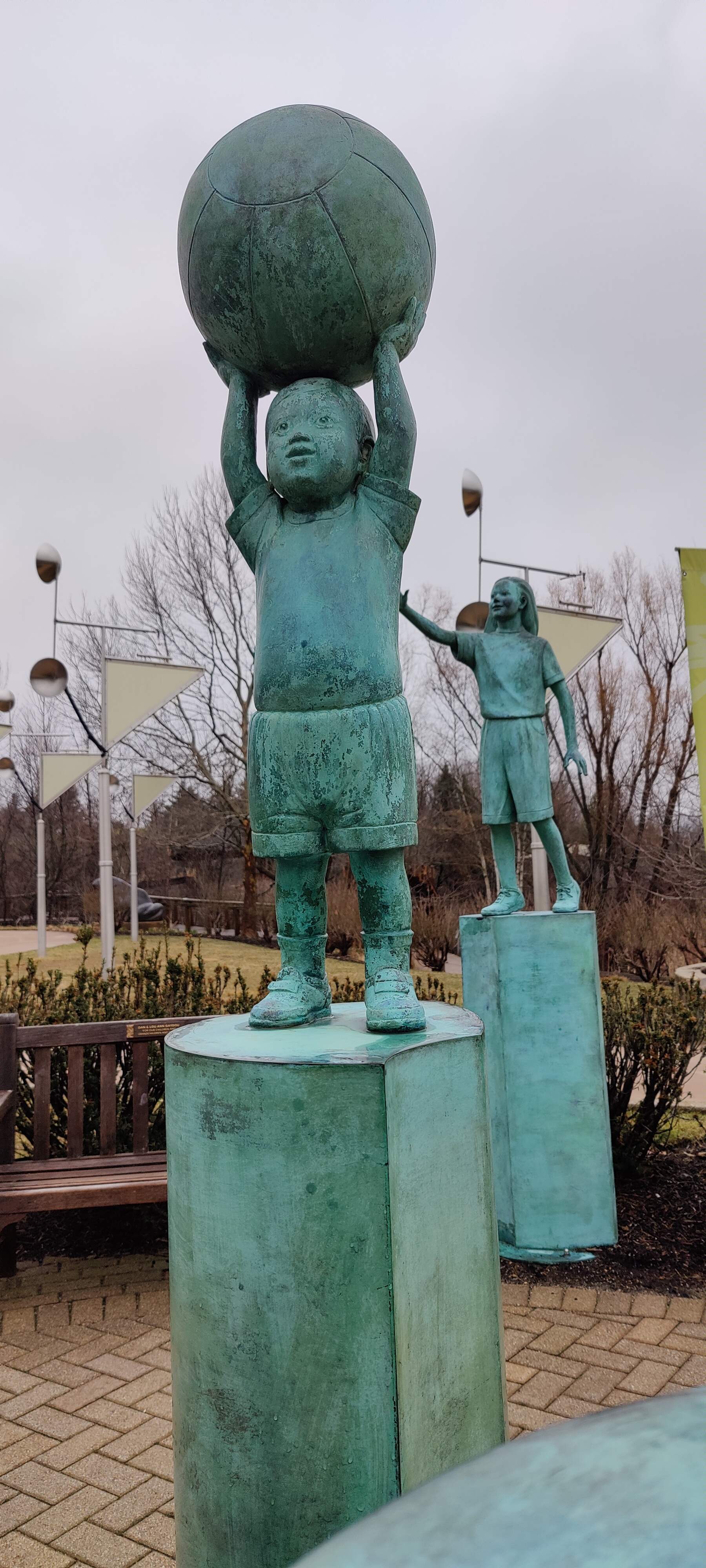 That ball is bigger than he is! (Kirk Newman. Children of the World, 1995.)